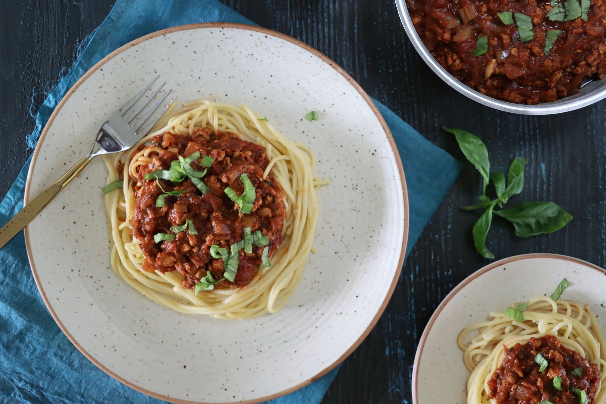 Spaghetti with rich tomato sauce in a white plate